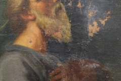 Particolare della testa del Santo inginocchiato fortemente manomessa da pesanti rifacimenti, prima del restauro